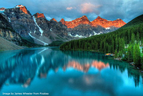 The image depicts one of the many colorful, beautiful lakes in Canada.