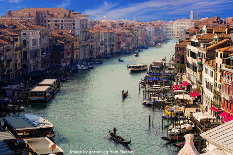 The image depicts the river in Venice, Italy.