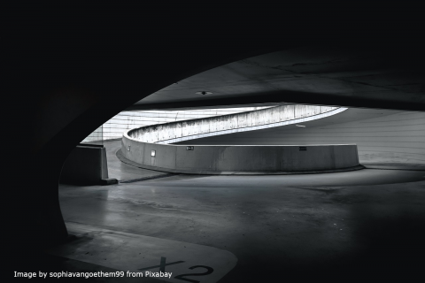 The picture is of a solemn parking garage with the text: Enhancing Precision and Control with Pacific Scientific Servo Drives